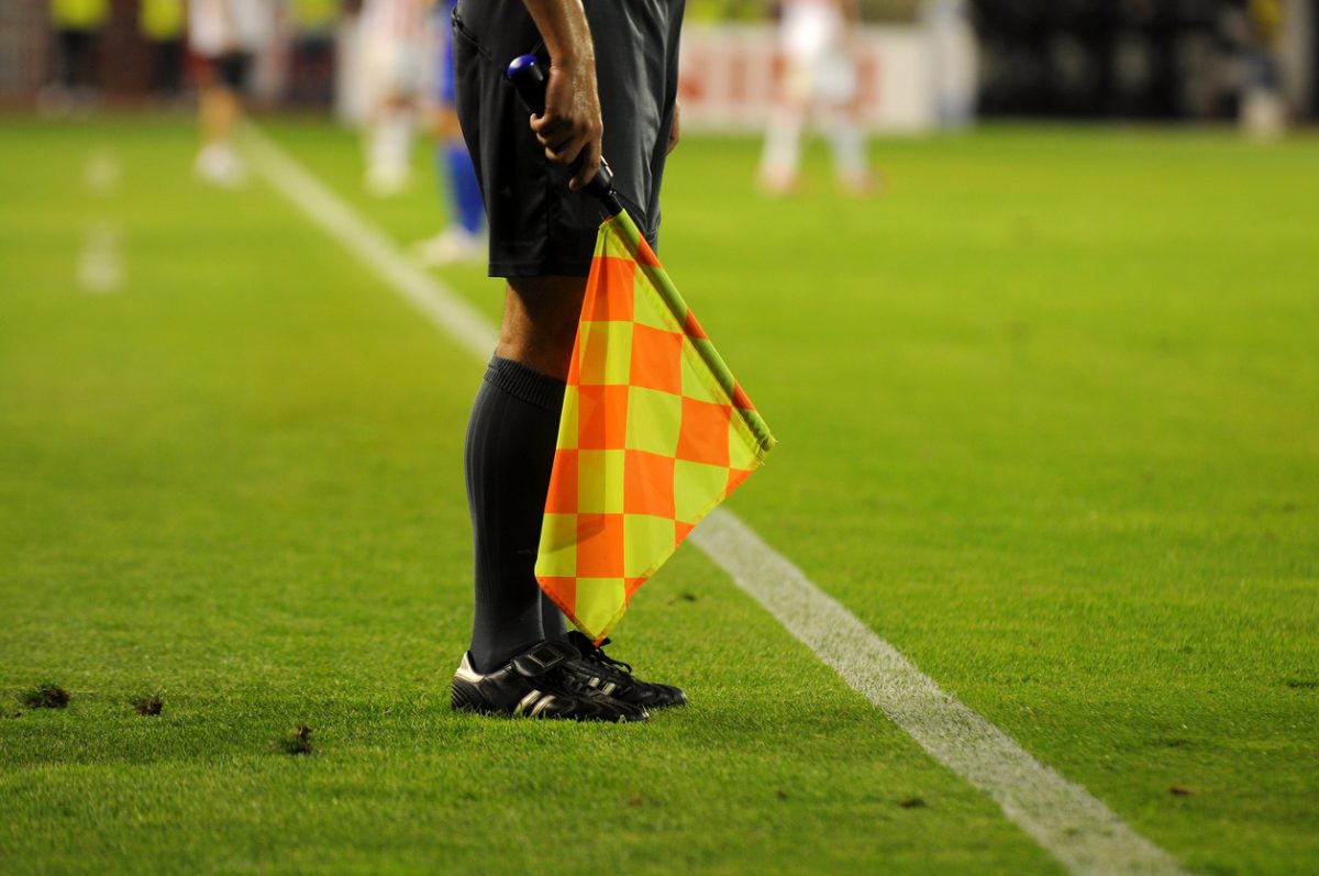 Football ref with flag