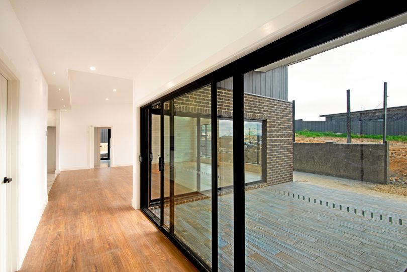 Floor-to-ceiling double-glazed glass walls to the alfresco area