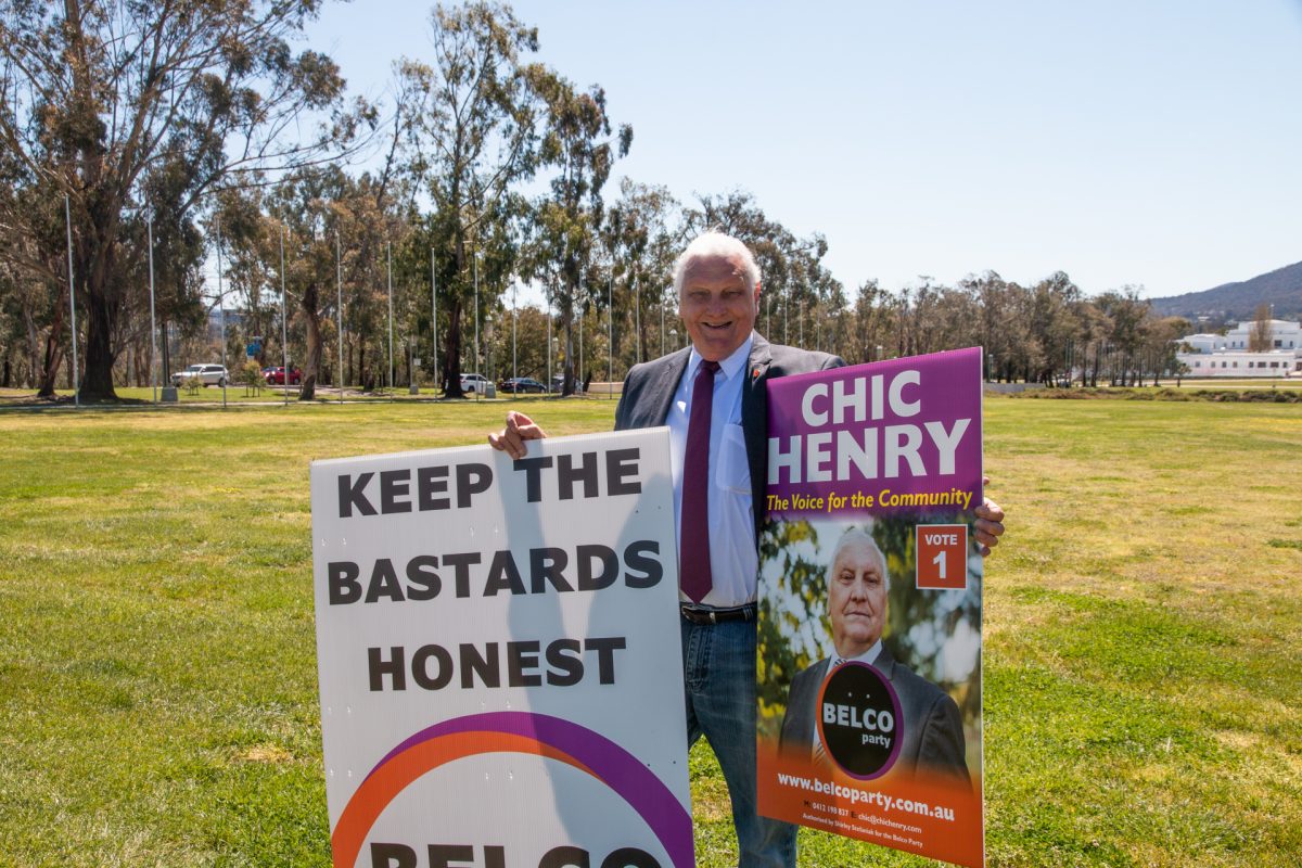 Chic Henry with signs for the Belco Party