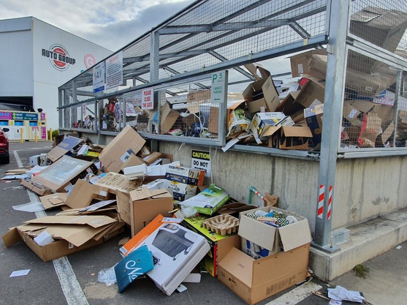 Carboard spills out from the collection cage at Gungahlin Recycling Drop-off Centre