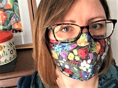 Dressed For Sunday owner Leah Bartsch wearing face mask