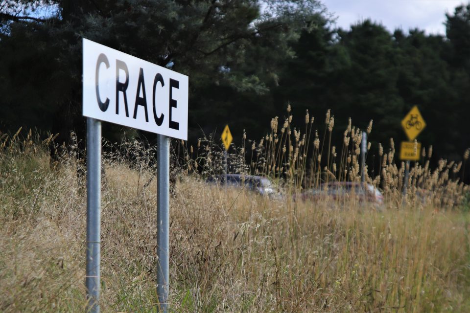 Crace suburb sign in long grass