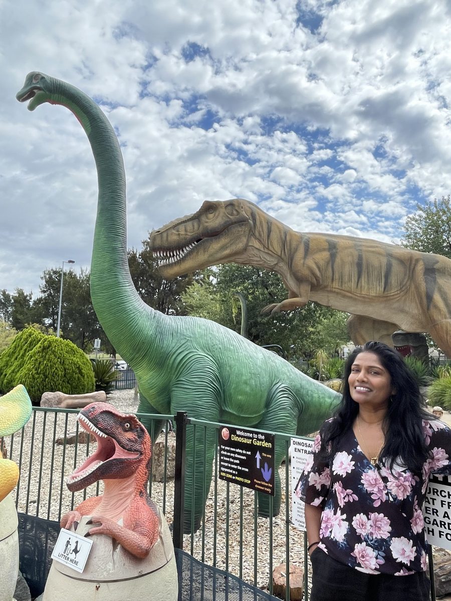 Woman with giant dinosaurs