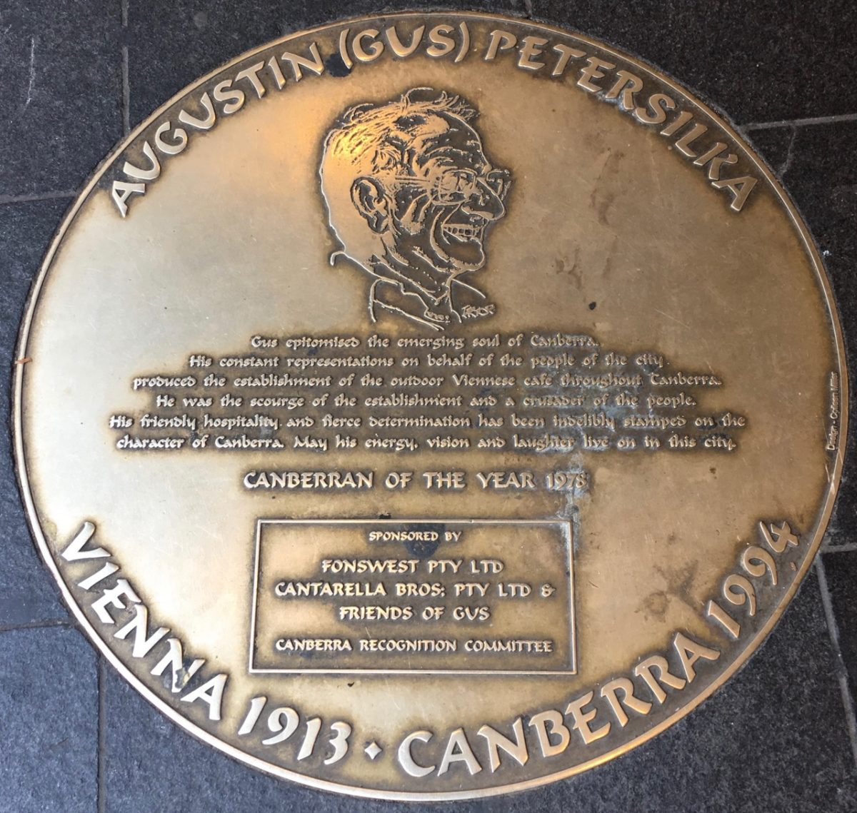The plaque on Bunda Street Canberra City commemorates Gus Petersilka