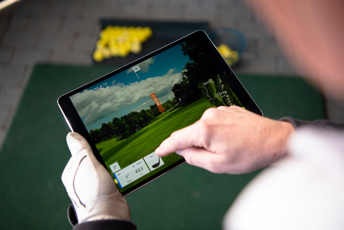 Close up photo of someone using the TrackMan technology on a ipad.