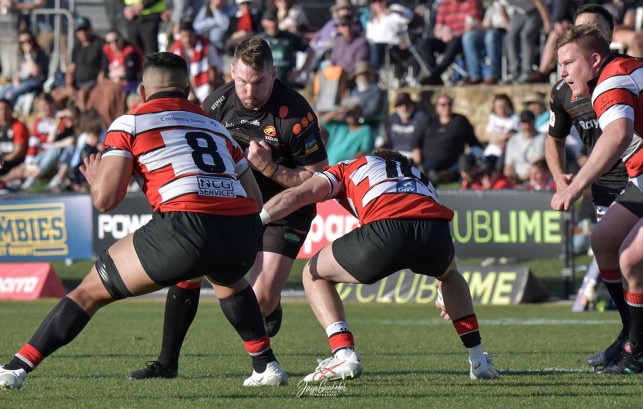 Gungahlin Eagles veteran Matt Hawke bracing for contact in the 2023 John I Dent Cup Grand Final. Photo: Jayzie Photography.