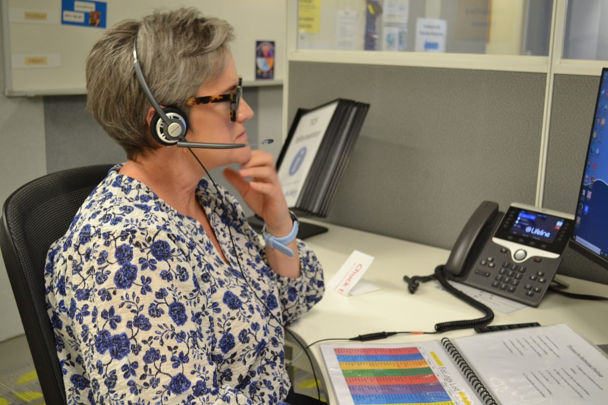 Woman on the phone at the Lifeline Crisis Support Phone Rooms