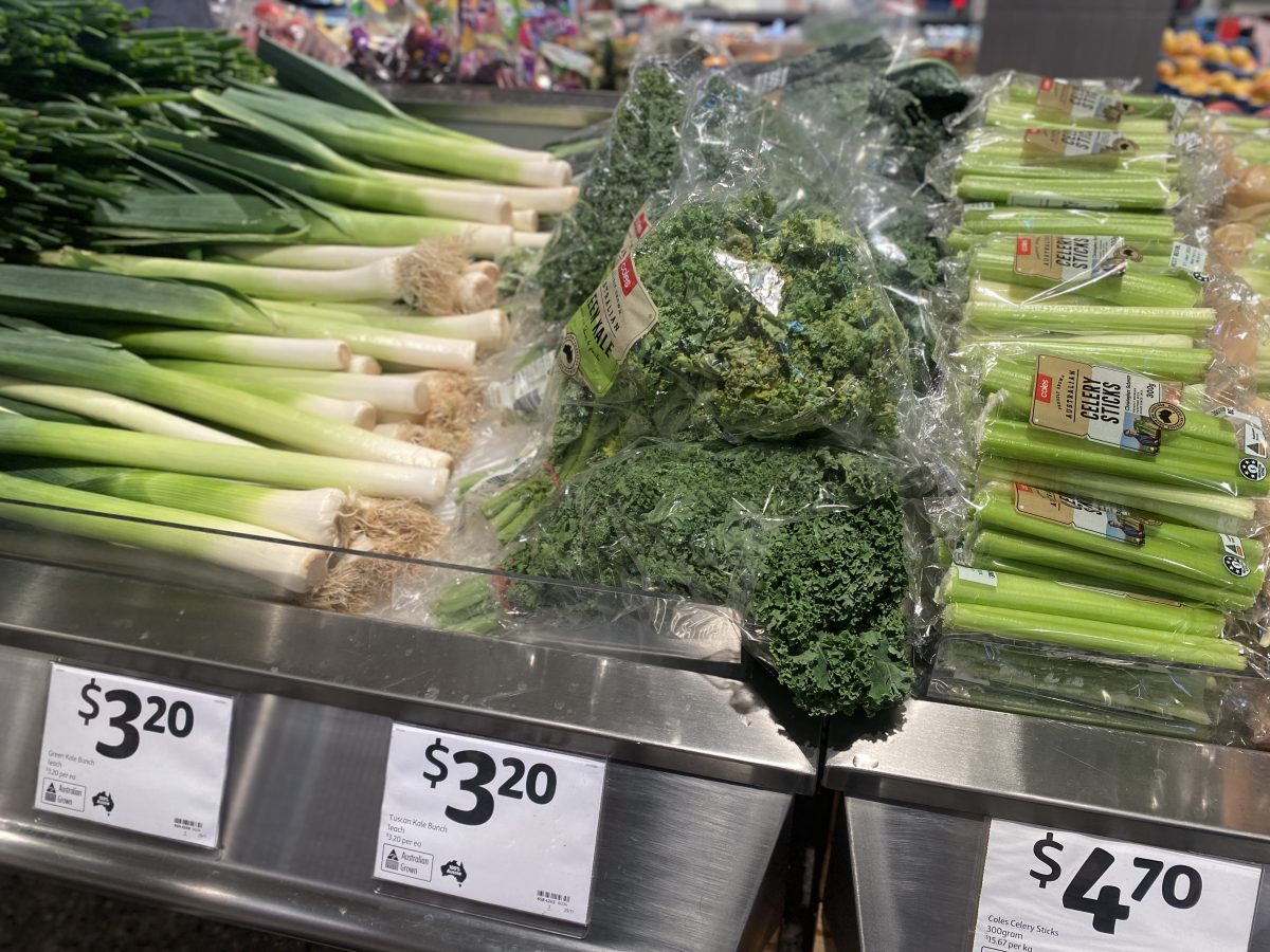Sad bunches of kale in plastic at Coles Dickson. 