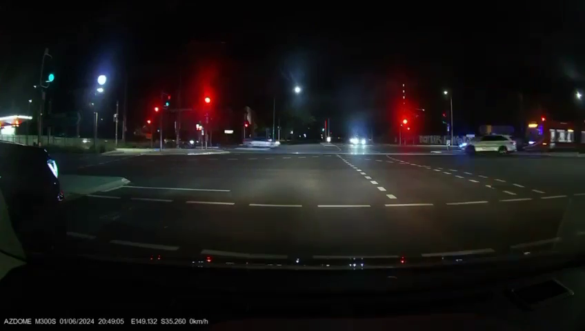 police car and traffic lights on Northborne Avenue