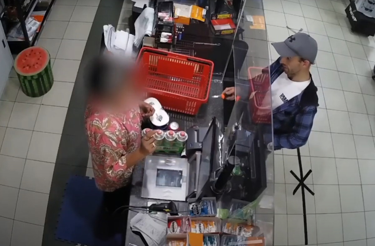 man holding a knife, threatening storeholder