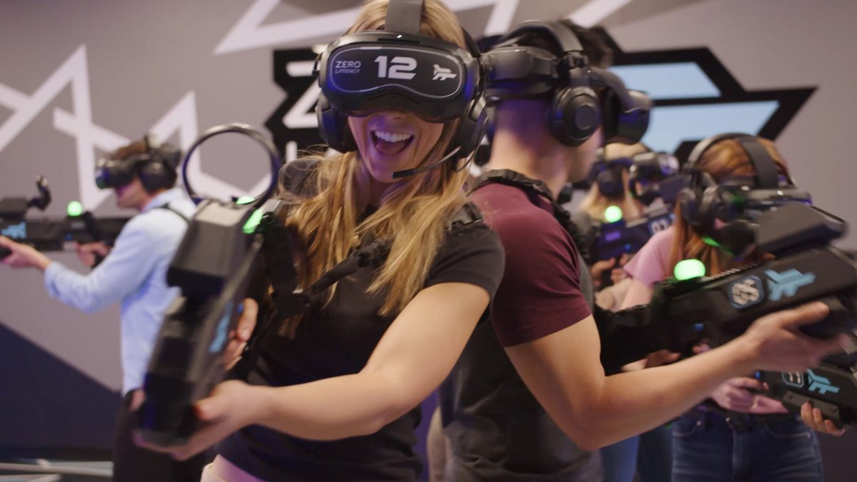 People posing for a photo in virtual reality apparel