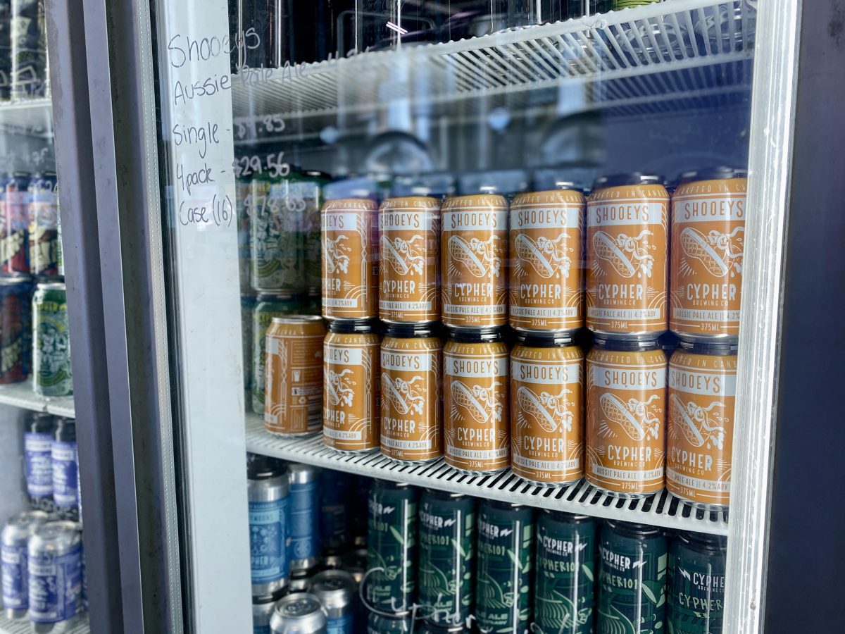 Cans of beer in the fridge.