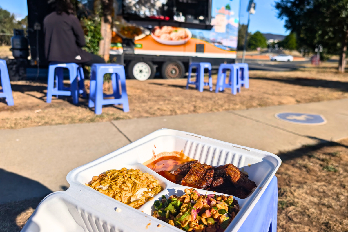 Dish of food out the front of a food truck.