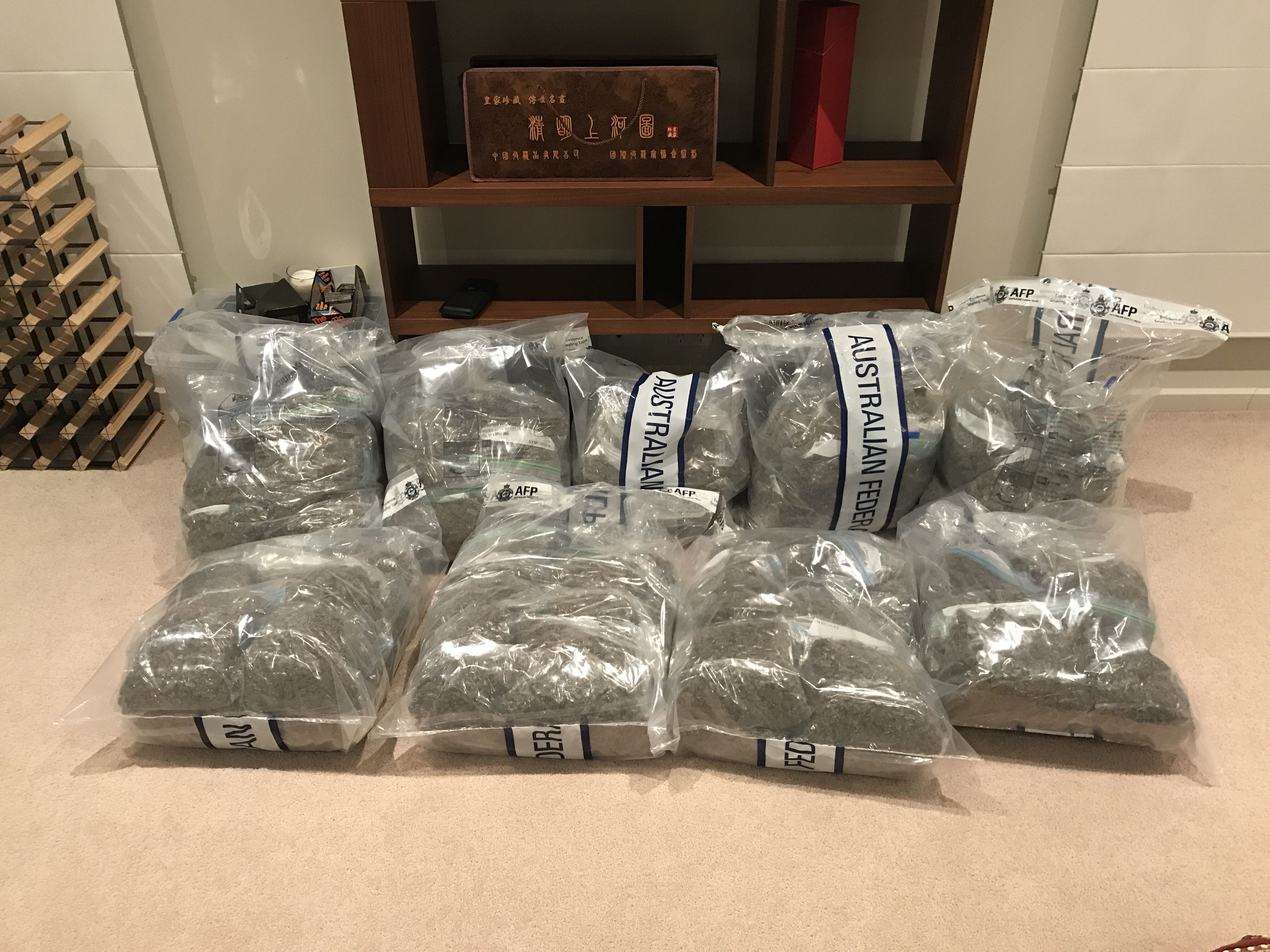 Police seize 43 kg of cannabis and cash after raids in Palmerston and Yarralumla